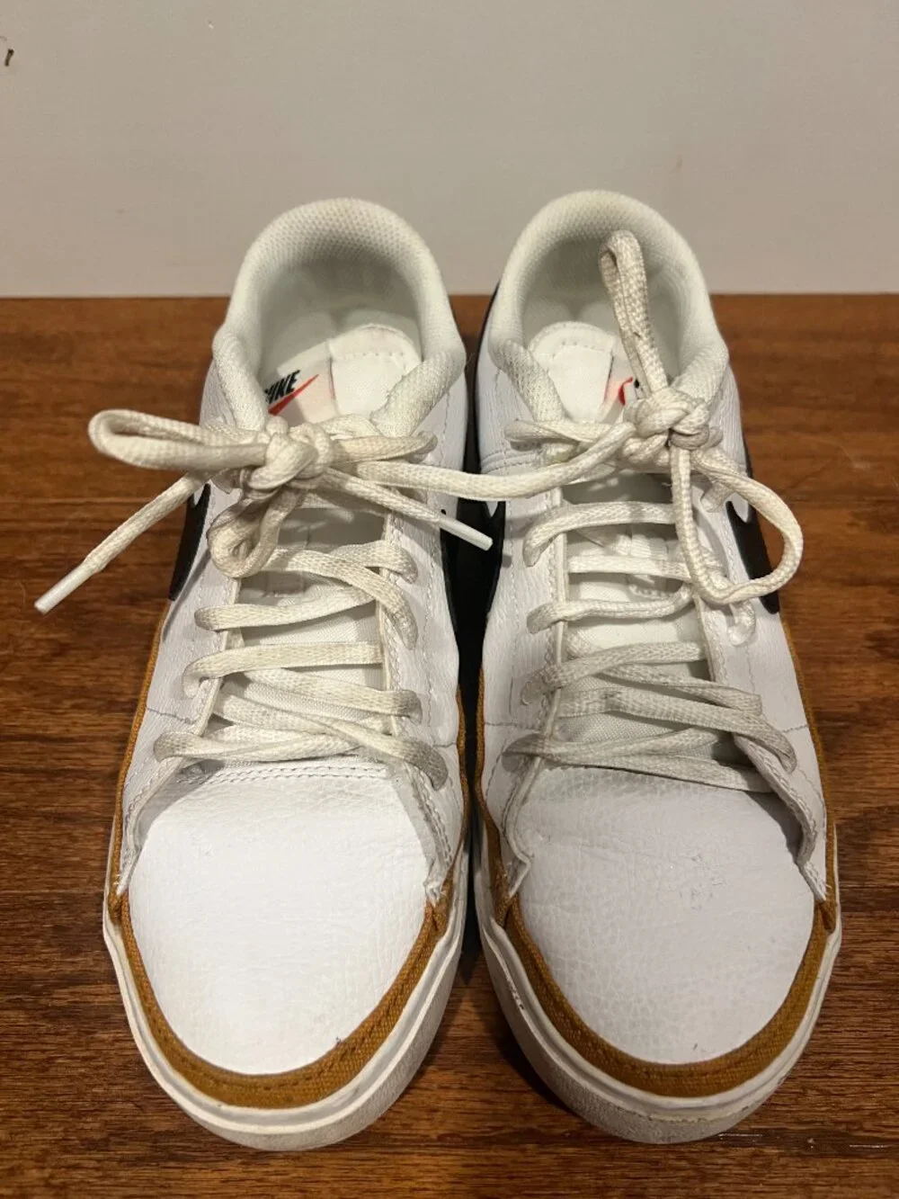 Nike Court Legacy White Sneakers with Black Swoosh and Tan Accent